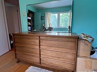 Front view showing 8 drawers and attached mirror