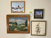 Wall view showing all four framed artworks