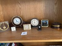 Overall view of all clocks on shelf