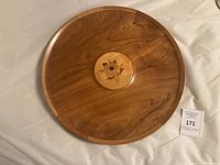 Full view of round teak tray with inlay and scale reference