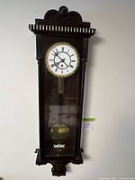 Front view of Vienna regulator wall clock in case
