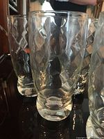 Front view of three tumblers showing Canadian Swirl pattern and bases