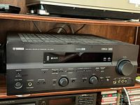 Front view of Yamaha RX-V659 receiver on shelf