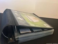 Closed binder showing capacity label