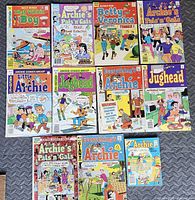 Overhead view of all 11 comics laid out on floor