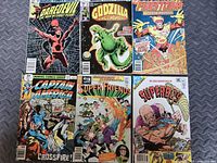 Six comics laid out in two rows showing full covers