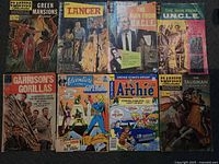 All eight comics laid out front covers visible