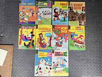 All ten Walt Disney Gold Key comics laid out on floor