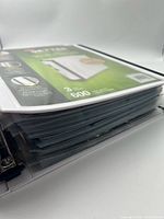 Closed binder showing thickness of filled pages