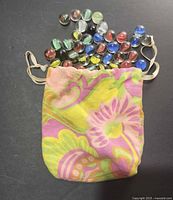 Bag opened showing marbles spilling out