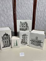 Five boxed Heritage Village Collection pieces displayed