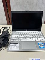 HP Stream laptop open with charger cable
