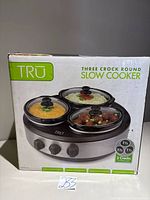 Box front displaying TRU three crock round slow cooker
