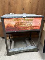 Front view showing full cooler on stand with advertising panel
