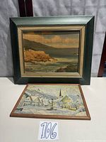 Both framed prints standing, Robert Wood on back, winter scene front
