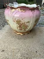 front view of porcelain planter showing floral design and color gradient