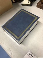 Closed blue book-style safe showing front cover