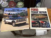 Front covers of manual and brochure side by side