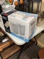 Boxed pair of Boss Marine MR4.3W speakers showing top and side panels