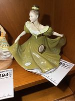 Front view of Royal Doulton Lynne figurine on shelf