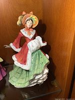Full view of Royal Doulton Wintertime figurine on shelf
