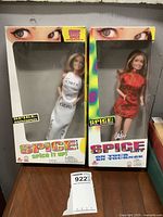 Front view of both boxed Spice Girls Geri dolls