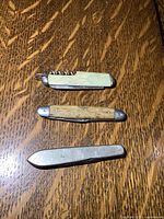 All three pocket tools closed to show handles and size