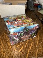 Closed damaged Primal Origin booster box front and side