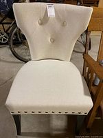 Front view of off-white accent chair