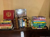 Overall view of assorted books on piano top