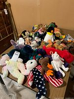 Pile of assorted Ty Beanie Babies on table