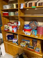 Full shelving view showing majority of tins