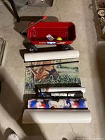 Overhead view of wagon with tennis ball and rolled posters