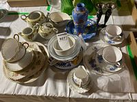 Overall view of assorted china, vase and candlesticks on table