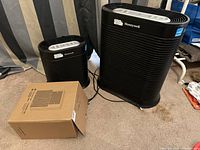 Two Honeywell air purifiers (large and medium) with boxed filter set