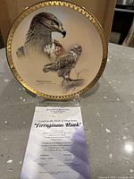 Front of plate showing artwork and gold rim