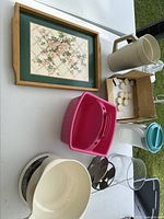 Overall shot showing all kitchenware items laid on table