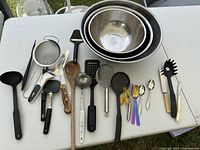 All items arranged on table including mixing bowls and utensils