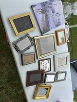 Overview of canvas print and assorted frames on table