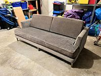 Front view of grey Kravet sofa with cushions