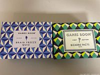 Both boxed quiz games side by side showing titles