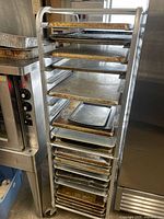 Front view of aluminum bun pan rack loaded with sheet pans