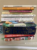 Stack of all 12 books showing most spines
