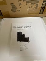 Assembly manual displaying product name and stacked cabinet illustration