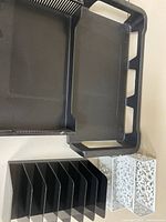 Overview showing one black paper tray, vertical sorter, and two white holders
