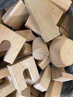 Close-up of assorted wooden blocks showing varied shapes and natural finish