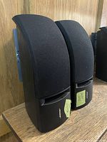 Pair of Bose 161 speakers angled view showing grilles and wall brackets