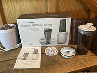 Full set showing motor base, cup, lid, disc, manual and box