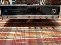 Front view of Panasonic RE-7800 receiver showing tape slot, controls and tuning dial