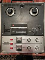 Front view showing controls, reel hubs, channel knobs